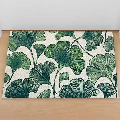 Feblilac Ginkgo Leaf Pattern PVC coil door mat at an entryway with a wooden door