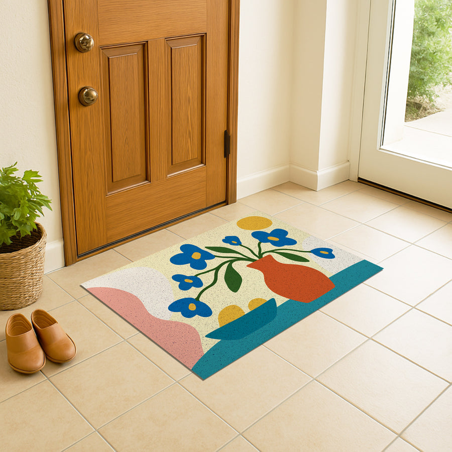 Feblilac Vase and Blue Flowers PVC coil door mat at an entryway with a wooden door