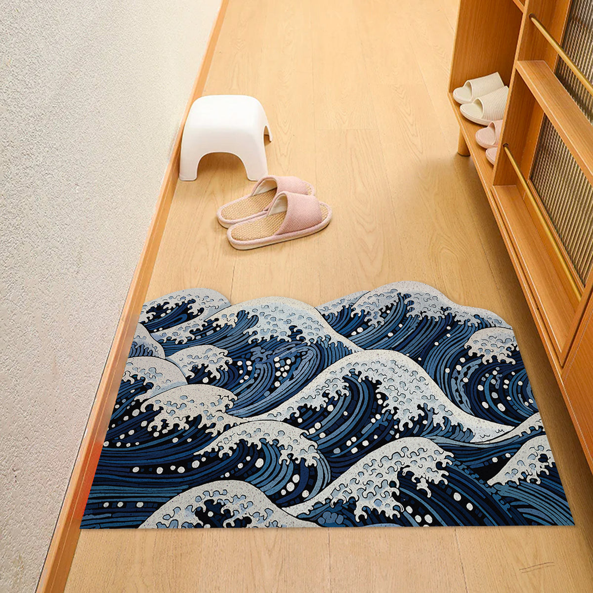 Feblilac Ukiyo-e Wave PVC coil door mat beside a doorway on grey stone