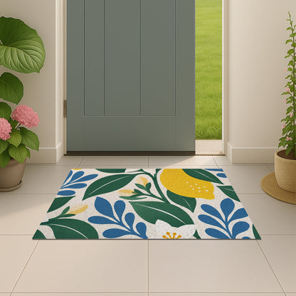 Feblilac Lemon Blossom PVC coil door mat beside a doorway on grey stone