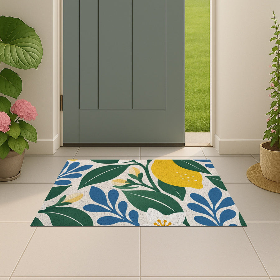 Feblilac Lemon Blossom PVC coil door mat beside a doorway on grey stone