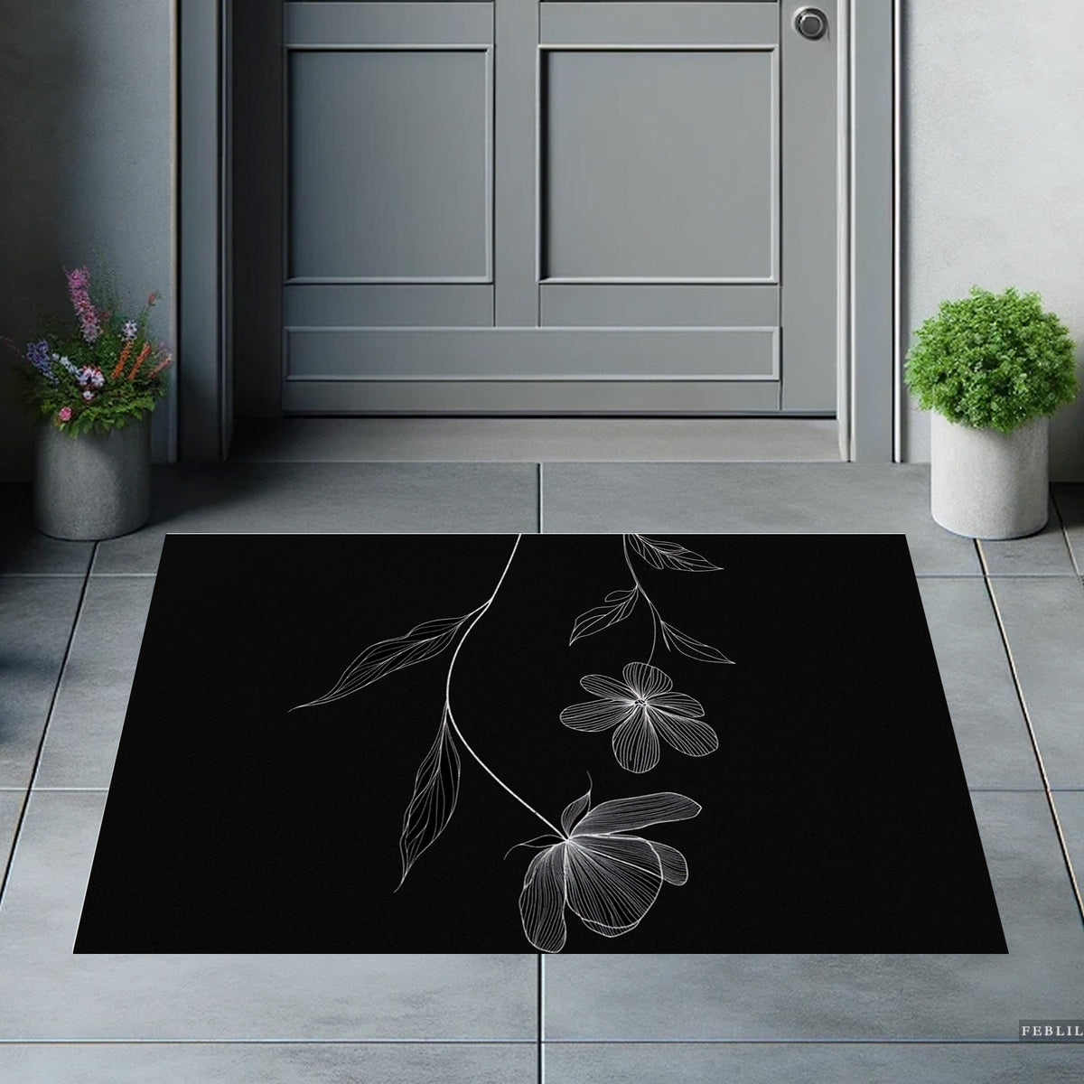 Feblilac Minimal Black and White Flowers PVC coil door mat on a paved patio by the entrance