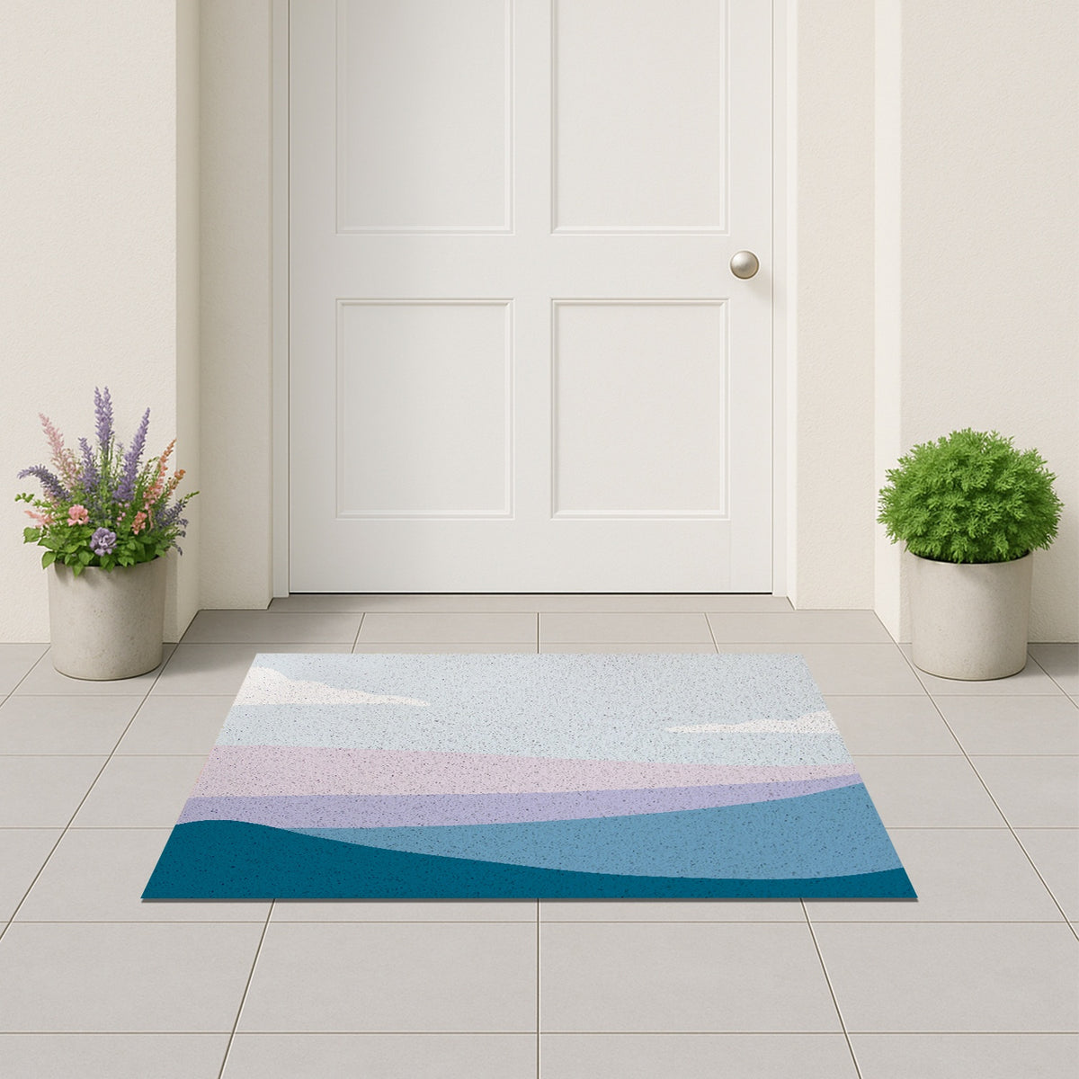 Feblilac Blue and Purple Mountain Mist PVC Coil Door Mat – Abstract Landscape Entrance Mat on a light stone patio in front of a white door